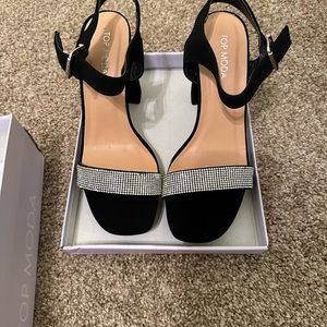Black heels. With rhinestones size 8 never worn